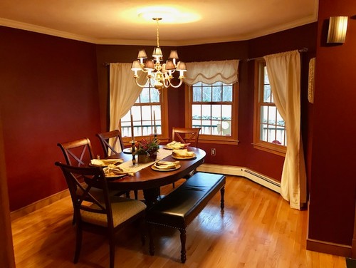 Formal dining room with deep red walls