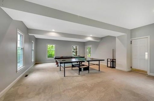 Basement recreation room with gray walls