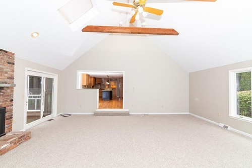 Living room with vaulted ceiling and exposed beam