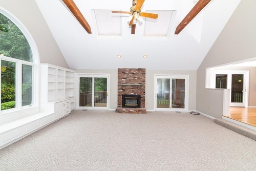Great room with brick fireplace and cathedral ceiling