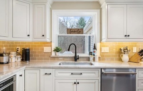 Refinished white kitchen cabinets