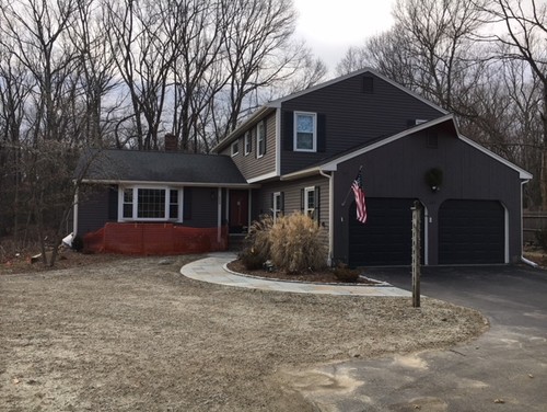Contemporary home with dark gray siding