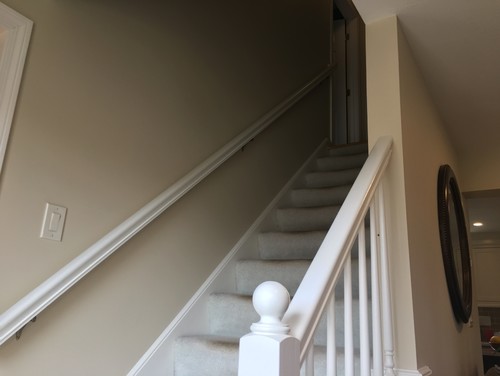 Staircase with painted white railings